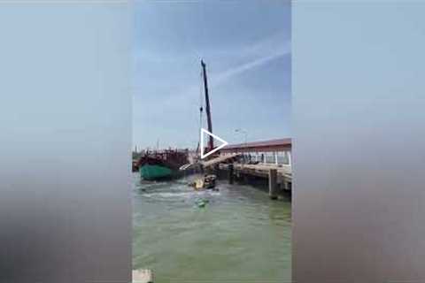 Driver escapes as crane falls into sea after cables snap!