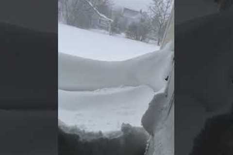 Snow wall outside front door in New York as winter storm hits US