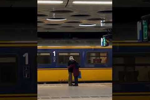 Elderly couple hug it out at Amsterdam airport subway