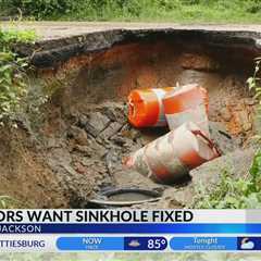 Jackson neighbors want sinkhole fixed