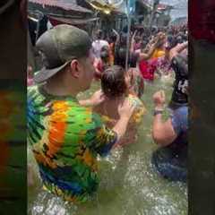 Filipinos Party Through Flooded Street