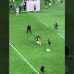 Pitch Invaders Get Tackled During Ceremony